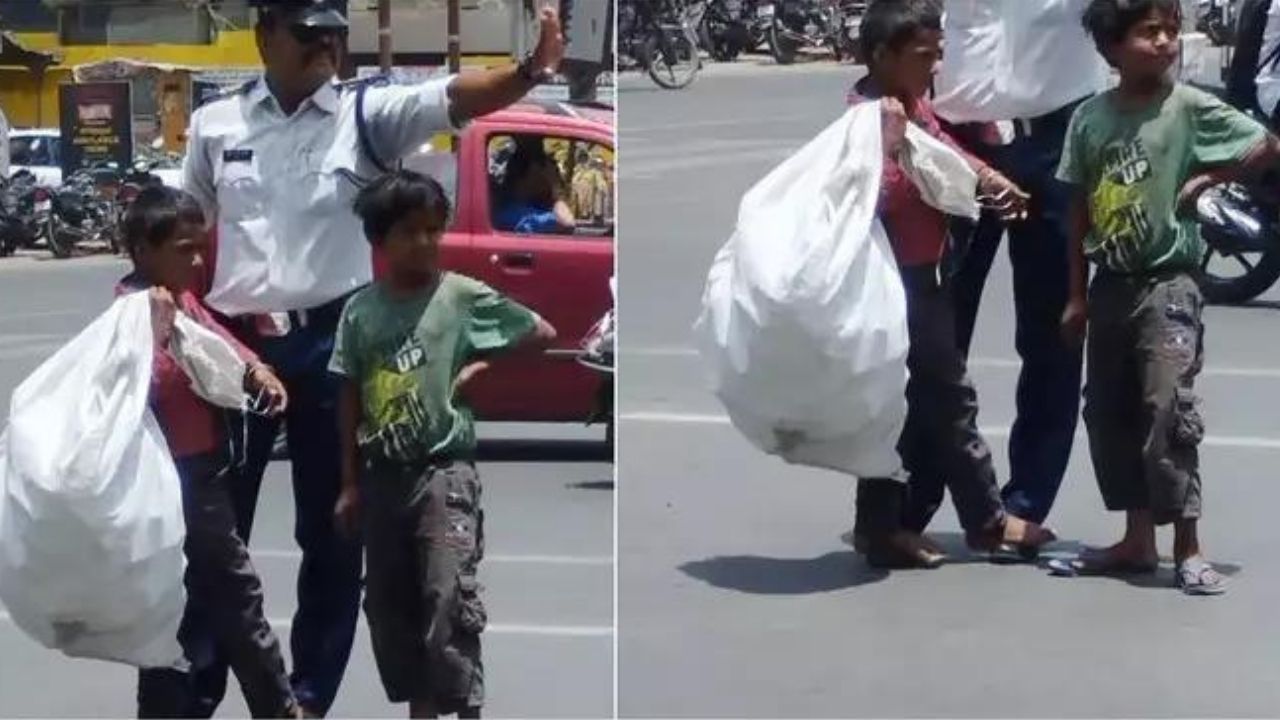 Viral News : धूप में बच्चे के जल रहे थे पैर, ट्रैफिक पुलिसवाले ने अपने पैरों पर खड़ा कर लिया, तस्वीर हुई वायरल