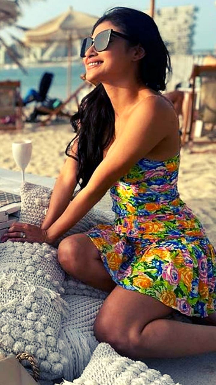 Mouni Roy's summer beach outfit hacks; actress sizzles in halter neck gown  & floral wears on a breezy beach day